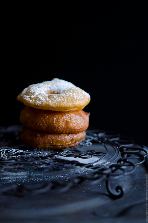 Sinemage Apple Fritters stacked on Cooling Rack